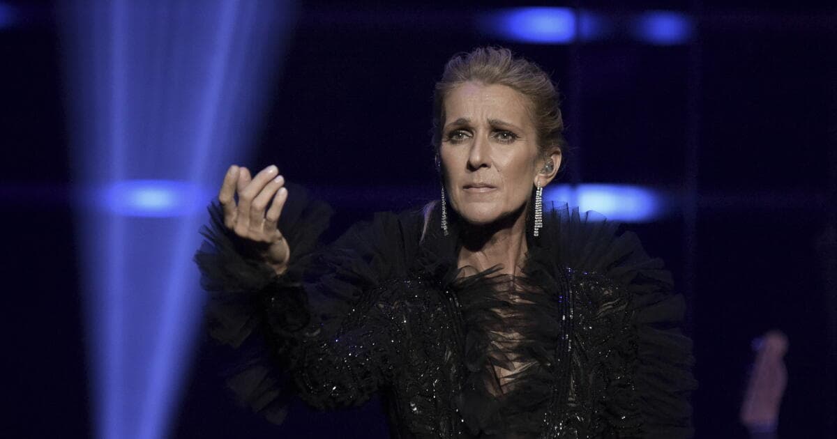 Céline Dion takes a tumble, but goes on